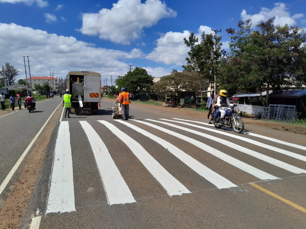 Thermoplastic zebra crossing pedestrian marking with equipment truck